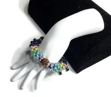 The multicolor flowers of the garden bracelet, handmade kumihimo wrislet, woman size, yellow,green,blue,pink,iris mix beads, macrame clasp,